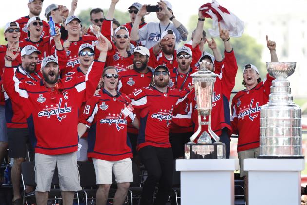 The Washington Capitals, including Alex Ovechkin, from Russia, front left, cheer as they celebrate winning the hockey Stanley Cup during a victory rally for the Washington Capitals, Tuesday, June 12, 2018, on the National Mall in Washington. (AP Photo/Jacquelyn Martin)