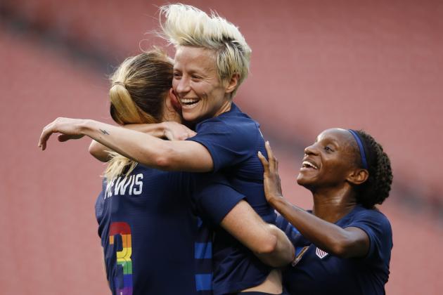 United States' Megan Rapinoe, center, celebrates with Samantha Mewis, left, and Crystal Dunn after scoring a goal against China during the first half of an international friendly soccer match Tuesday, June 12, 2018, in Cleveland. (AP Photo/Ron Schwane)