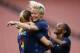 United States' Megan Rapinoe, center, celebrates with Samantha Mewis, left, and Crystal Dunn after scoring a goal against China during the first half of an international friendly soccer match Tuesday, June 12, 2018, in Cleveland. (AP Photo/Ron Schwane)