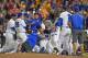OMAHA, NE - JUNE 27: Players of the Florida Gators celebrate after defeating the LSU Tigers 6-1 to win the National Championship at the College World Series on June 27, 2017 at TD Ameritrade Park in Omaha, Nebraska. (Photo by Peter Aiken/Getty Images)