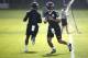 Baltimore Ravens quarterback Joe Flacco, right, runs a drill past quarterback Lamar Jackson during an NFL football practice at the team's headquarters in Owings Mills, Md., Tuesday, June 12, 2018. (AP Photo/Patrick Semansky)