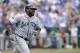 KANSAS CITY, MO - APRIL 17: Milton Bradley #15 of the Seattle Mariners runs to first base after hitting the ball in the game against the Kansas City Royals on April 17, 2011 at Kauffman Stadium in Kansas City, Missouri. The Seattle Mariners defeated the Royals 3-2. (Photo by John Williamson/MLB Photos via Getty Images)