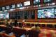 FILE – In this May 14, 2018, file photo, people make bets in the sports book at the South Point hotel and casino in Las Vegas. A day before New Jersey’s governor makes his state’s first legal wager on a sporting event, sports betting will be the main topic at a major gambling industry conference in Atlantic City. The East Coast Gaming Congress on Wednesday, June 13, will discuss where sports betting stands and what might be next now that New Jersey has won a U.S. Supreme Court case clearing the way for all 50 states to legalize it if they choose. (AP Photo/John Locher, File)