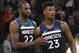 Minnesota Timberwolves forward Jimmy Butler (23) is congratulated by Timberwolves guard Andrew Wiggins (22) after scoring on the Los Angeles Clippers in the fourth quarter of an NBA basketball game on Sunday, Dec. 3, 2017, in Minneapolis. The Timberwolves defeated the Clippers 112-106. (AP Photo/Andy Clayton-King)
