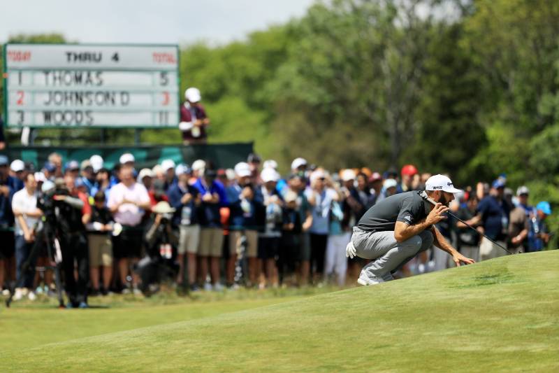 SOUTHAMPTON, NY - JUNE 15: Dustin Johnson of the United States lines up a putt on the fifth green during the second round of the 2018 U.S. Open at Shinnecock Hills Golf Club on June 15, 2018 in Southampton, New York. (Photo by Mike Ehrmann/Getty Images)