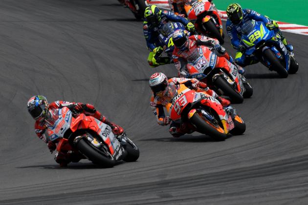 (FromL) Ducati Team's Spanish rider Jorge Lorenzo, Repsol Honda Team's Spanish rider Marc Marquez and Ducati Team's Italian rider Andrea Dovizioso ride during the Catalunya MotoGP Grand Prix race at the Catalunya racetrack in Montmelo, near Barcelona on June 17, 2018. (Photo by LLUIS GENE / AFP)        (Photo credit should read LLUIS GENE/AFP/Getty Images)