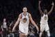 Golden State Warriors guard Klay Thompson (11) and forward Draymond Green (23) reacts after Thompson scored a three-point basket during the final minutes of the second half of an NBA basketball game against the Brooklyn Nets, Sunday, Nov. 19, 2017, in New York. (AP Photo/Mary Altaffer)