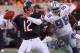 Chicago Bears lineman Andy Heck, middle, provides protection for quarterback Erik Kramer from Dallas Cowboys defensive end Greg Ellis (98) during the third quarter of the Bears' 13-12 win Sunday, Oct. 18, 1998, at Soldier Field in Chicago. Kramer went 18-of-30 for 233 yards and one touchdown. (AP Photo/Charles Bennett)