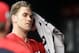 Washington Nationals' Bryce Harper towels off in the dugout before the continuation of a suspended baseball game against the New York Yankees, Monday, June 18, 2018, in Washington. This game is a continuation of a suspended game from May 15. (AP Photo/Nick Wass)