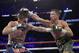 Gennady Golovkin, right, connects with a right to Canelo Alvarez during a middleweight title fight Sunday, Sept. 17, 2017, in Las Vegas. (AP Photo/John Locher)