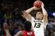FILE - In this March 8, 2018, file photo, Missouri's Michael Porter Jr. (13) shoots over Georgia's Yante Maten during the first half in an NCAA college basketball game at the Southeastern Conference tournament, in St. Louis. Michael Porter Jr. played in three games in college because of back problems, but his talent has long been considered more than NBA-ready. He is the epitome of high-risk, high-reward in this draft. (AP Photo/Jeff Roberson, File)
