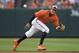 Baltimore Orioles shortstop Manny Machado (13) fields a ball that went for a single by Miami Marlins' JT Riddle during the ninth inning of a baseball game, Saturday, June 16, 2018, in Baltimore. (AP Photo/Nick Wass)