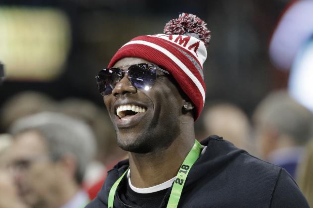 Terrell Owens smiles before the NCAA college football playoff championship game between Georgia and Alabama, Monday, Jan. 8, 2018, in Atlanta. (AP Photo/David J. Phillip)