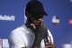 Cleveland Cavaliers forward LeBron James wipes his face during a news conference following Game 4 of basketball's NBA Finals against the Golden State Warriors, early Saturday, June 9, 2018, in Cleveland. The Warriors defeated the Cavaliers 108-85 to win the NBA championship. (AP Photo/Carlos Osorio)