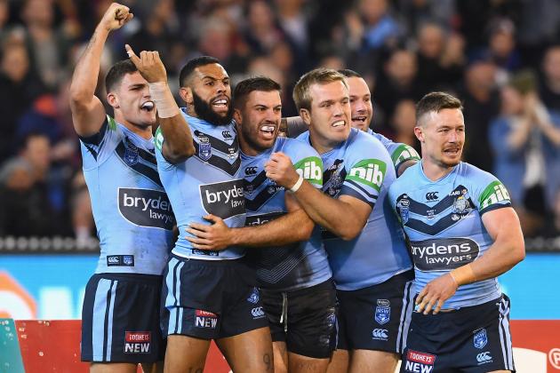 MELBOURNE, AUSTRALIA - JUNE 06: James Tedesco of the Blues  is congratulated by team mates after scoring a try during game one of the State Of Origin series between the Queensland Maroons and the New South Wales Blues at the Melbourne Cricket Ground on June 6, 2018 in Melbourne, Australia.  (Photo by Quinn Rooney/Getty Images)