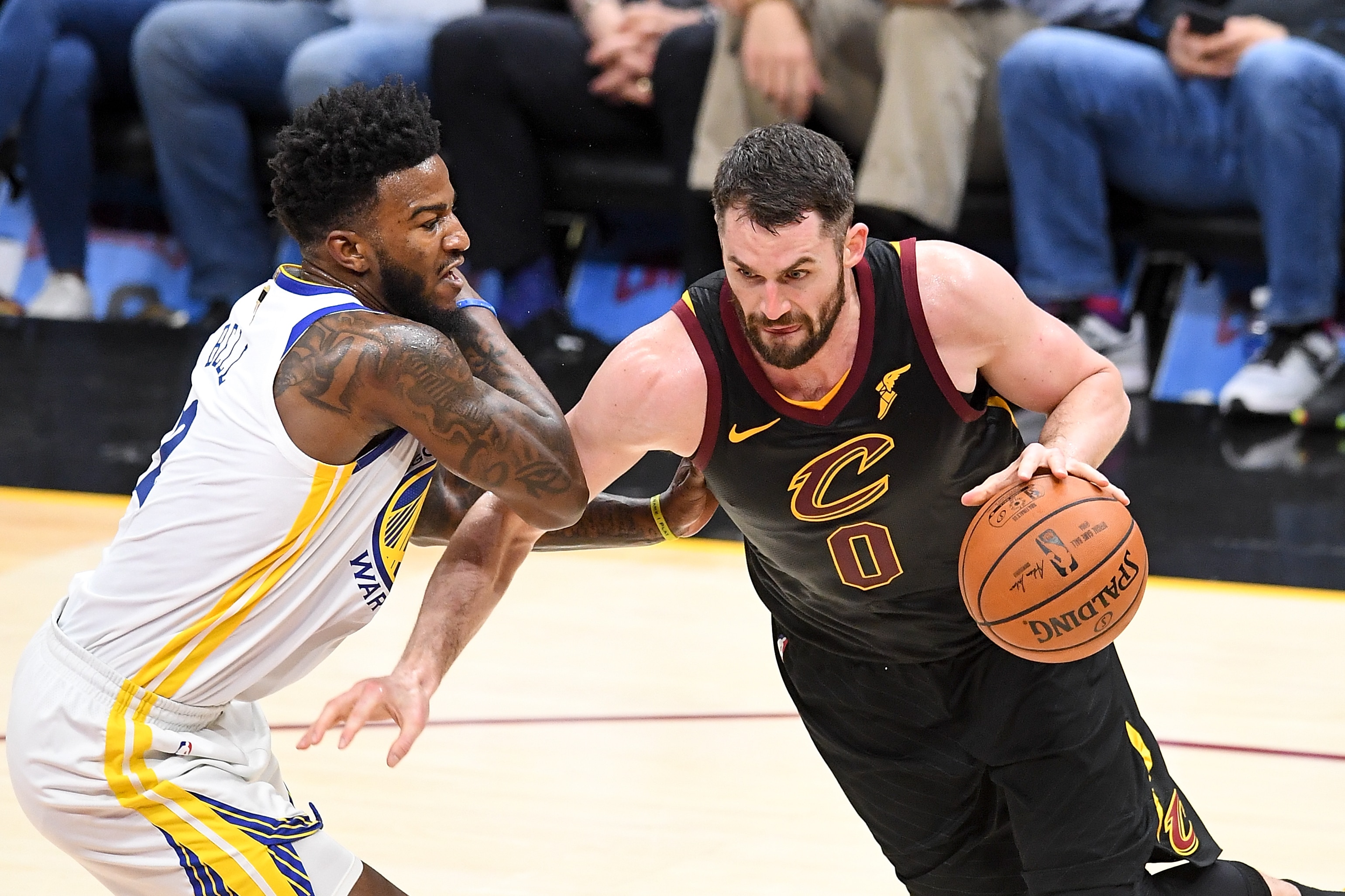 CLEVELAND, OH - JUNE 08: Kevin Love #0 of the Cleveland Cavaliers drives to the basket defended by Jordan Bell #2 of the Golden State Warriors in the first half during Game Four of the 2018 NBA Finals at Quicken Loans Arena on June 8, 2018 in Cleveland, Ohio. NOTE TO USER: User expressly acknowledges and agrees that, by downloading and or using this photograph, User is consenting to the terms and conditions of the Getty Images License Agreement. (Photo by Jason Miller/Getty Images)