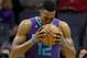 Charlotte Hornets' Dwight Howard (12) kisses the basketball before the start of an NBA basketball game against the Indiana Pacers in Charlotte, N.C., Sunday, April 8, 2018. (AP Photo/Chuck Burton)