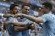 Uruguay's Luis Suarez , left, is greeted by teammates after scoring his team's opening goal during the group A match against Saudi Arabia at the 2018 soccer World Cup in Rostov Arena in Rostov-on-Don, Russia, Wednesday, June 20, 2018. (AP Photo/Andrew Medichini)