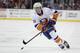 New York Islanders center Mathew Barzal skates against the New Jersey Devils during the first period of an NHL hockey game, Saturday, March 31, 2018, in Newark, N.J. (AP Photo/Julio Cortez)