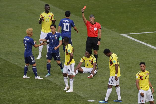 Referee Damir Skomina from Slovenia shows a red card to Colombia's Carlos Sanchez, on the ground, during the group H match between Colombia and Japan at the 2018 soccer World Cup in the Mordavia Arena in Saransk, Russia, Tuesday, June 19, 2018. (AP Photo/Vadim Ghirda)