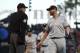 Miami Marlins pitcher Dan Straily, right, speaks with home plate umpire Andy Fletcher after Straily hit San Francisco Giants' Buster Posey with a pitch and was ejected by Fletcher during the second inning of a baseball game Tuesday, June 19, 2018, in San Francisco. (AP Photo/Ben Margot)