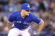 TORONTO, ON - APRIL 28: Roberto Osuna #54 of the Toronto Blue Jays looks in before delivering a pitch in the ninth inning during MLB game action against the Texas Rangers at Rogers Centre on April 28, 2018 in Toronto, Canada. (Photo by Tom Szczerbowski/Getty Images) *** Local Caption *** Roberto Osuna
