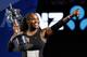 FILE - In this Saturday, Jan. 28, 2017, file photo, United States' Serena Williams holds her trophy after defeating her sister Venus during the women's singles final at the Australian Open tennis championships in Melbourne, Australia. Unbeknownst to fans and foes, Serena Williams was two months pregnant when she won the 2017 Australian Open. Williams is expected to have a strong 2018. (AP Photo/Dita Alangkara, File)