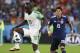 Senegalese Sadio Mane, left, controls the ball ahead of Japan's Hiroki Sakai in the H group match between Japan and Senegal at the 2018 World Cup soccer tournament at Yekaterinburg Arena in Yekaterinburg, Russia on Sunday. June 24, 2018. (AP Photo / Eugene Hoshiko)