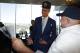 Steve Stretz, right, shows the front page of the sports section of The Denver Post to Michael Porter Jr., center, the Denver Nuggets first-round pick in the NBA Draft, after a news conference to introduce the player to the media Friday, June 22, 2018, in Denver. (AP Photo/David Zalubowski)