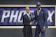 Arizona's Deandre Ayton, right, poses with NBA Commissioner Adam Silver after he was picked first overall by the Phoenix Suns during the NBA basketball draft in New York, Thursday, June 21, 2018. (AP Photo/Kevin Hagen)