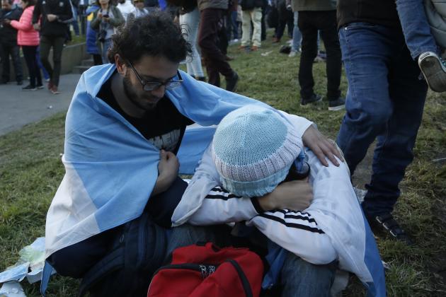 An Argentina fan comforts a friend at the end of a televised broadcast of the Croatia vs Argentina World Cup soccer match, in Buenos Aires, Argentina, Thursday, June 21, 2018. Argentina lost 3-0 to Croatia. (AP Photo Jorge Saenz)