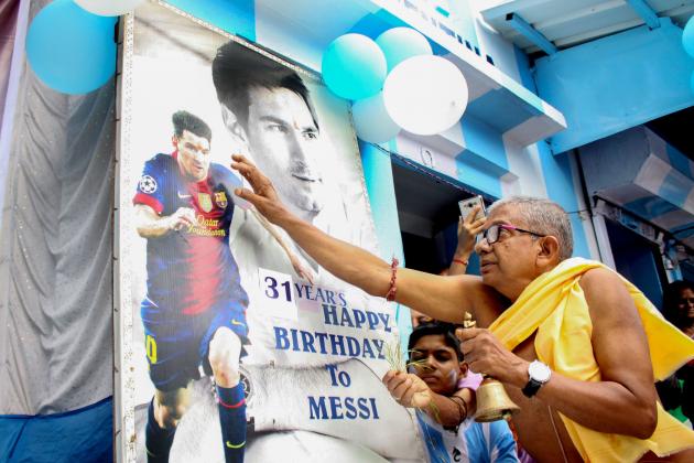 Indian fans of Argentina and Lionel Messi, celebrate his 31st birthday at a three-storey apartment painted in blue-and-white by Indian tea seller Shib Shankar Patra at Ichapore, some 35 km from Kolkata on June 24, 2018. (Photo by - / AFP)        (Photo credit should read -/AFP/Getty Images)