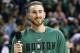 Boston Celtics Gordon Hayward addresses the crowd before an NBA basketball game against the Washington Wizards in Boston, Monday, Dec. 25, 2017. (AP Photo/Michael Dwyer)