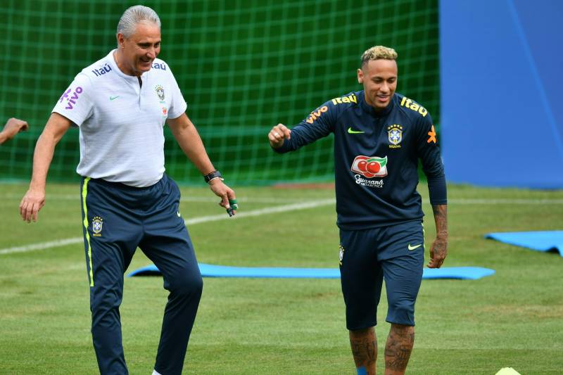 Brazil's coach Tite (L) and Brazil's forward Neymar are seen during a training session of Brazil national football team at Yug Sport Stadium, in Sochi, on June 19, 2018, ahead of the Russia 2018 World Cup football tournament. (Photo by Nelson Almeida / AFP) (Photo credit should read NELSON ALMEIDA/AFP/Getty Images)