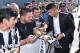 Portuguese player Joao Cancelo signs autographs to fans as he arrives at Juventus Medical center for a medical check up, in Turin, northern Italy, Wednesday, June 27, 2018. (Alessandro Di Marco/ANSA via AP)