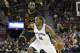 San Antonio Spurs' Kawhi Leonard (2) drives past Cleveland Cavaliers' LeBron James (23) in the first half of an NBA basketball game, Saturday, Jan. 21, 2017, in Cleveland. (AP Photo/Tony Dejak)
