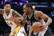 Kawhi Leonard of San Antonio Spurs, right, pbades Brandon Ingram of the Los Angeles Lakers during the second half of an NBA basketball game on Sunday, February 26, 2017 in Los Angeles. (AP Photo / Jae C. Hong)