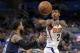 Phoenix Suns' Elfrid Payton passes the ball around Orlando Magic's D.J. Augustin, left, during the second half of an NBA basketball game, Saturday, March 24, 2018, in Orlando, Fla. (AP Photo/John Raoux)