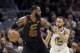 Cleveland Cavaliers' LeBron James is defended by Golden State Warriors' Stephen Curry in the first half of Game 3 of basketball's NBA Finals, Wednesday, June 6, 2018, in Cleveland. (AP Photo/Tony Dejak)