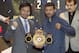 Philippine senator and boxing hero Manny Pacquiao, left, and Argentine WBA welterweight champion Lucas Matthysse pose for photographers as they hold the WBA welterweight champion belt during a press conference in Kuala Lumpur, Malaysia Friday, April 20, 2018. The two are scheduled to fight on July 15, for the World Boxing Association welterweight title in Malaysia. (AP Photo/Vincent Thian