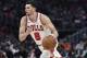 Chicago Bulls guard Zach LaVine drives during the second half of an NBA basketball game against the Detroit Pistons, Friday, March 9, 2018, in Detroit. (AP Photo/Carlos Osorio)
