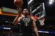 Milwaukee Bucks forward Jabari Parker (12) in the second half overtime of an NBA basketball game Sunday, April 1, 2018, in Denver. The Nuggets won 128-125 in overtime. (AP Photo/David Zalubowski)