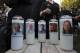 Photos of five journalists adorn candles during a vigil across the street from where they were slain in their newsroom in Annapolis, Md., Friday, June 29, 2018. Prosecutors say Jarrod W. Ramos opened fire Thursday in the Capital Gazette newsroom. (AP Photo/Jose Luis Magana)