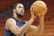 Utah Jazz forward Derrick Favors (15) warms up prior to an NBA basketball game against the Miami Heat, Sunday, Jan. 7, 2018, in Miami. (AP Photo/Joel Auerbach)