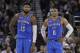 Oklahoma City Thunder's Russell Westbrook (0) stands next to teammate Paul George (13) during the first half of an NBA basketball game against the Golden State Warriors Tuesday, Feb. 6, 2018, in Oakland, Calif. (AP Photo/Marcio Jose Sanchez)