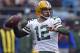 FILE - In this Dec. 17, 2017, file photo, Green Bay Packers' Aaron Rodgers looks to pass against the Carolina Panthers during the first half of an NFL football game in Charlotte, N.C. Rodgers wants to follow Tom Brady's path and still chuck it when he's in his 40s. He also accepts that in today's NFL he might again follow Brett Favre's footsteps and one day don something other than the green and gold. (AP Photo/Mike McCarn, File)