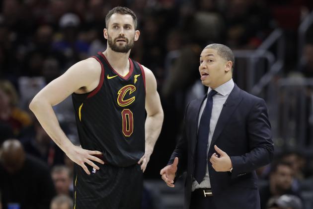 Cleveland Cavaliers coach Tyronn Lue talks with Kevin Love during the second half in Game 4 against the Golden State Warriors in basketball's NBA Finals, Friday, June 8, 2018, in Cleveland. (AP Photo/Tony Dejak)