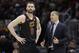 Cleveland Cavaliers coach Tyronn Lue talks with Kevin Love during the second half in Game 4 against the Golden State Warriors in basketball's NBA Finals, Friday, June 8, 2018, in Cleveland. (AP Photo/Tony Dejak)