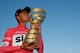 Pink jersey and winner, Britain's rider of team Sky Christopher Froome, kisses the trophy on the podium after the 21st and last stage of the 101st Giro d'Italia, Tour of Italy cycling race, on May 27, 2018 in Rome. - Britain's Chris Froome completed a sensational comeback to win the Giro d'Italia on Sunday for a rare Grand Tour treble after the 21st and final stage in Rome. Froome, 33, became the first Briton to win the race in the Giro's 101-year history after the 115km closed circuit race through the streets of the Italian capital. (Photo by LUK BENIES / AFP) (Photo credit should read LUK BENIES/AFP/Getty Images)