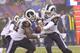 Los Angeles Rams quarterback Sean Mannion, right, hands the ball off to Los Angeles Rams running back Malcolm Brown during the second half of an NFL football game Sunday, Nov. 5, 2017, in East Rutherford, N.J. (AP Photo/Bill Kostroun)